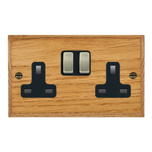 Hamilton WCMSS2AB-B Woods Chamfered Medium Oak 2 gang 13A Double Pole Switched Socket Antique Brass/Black Insert