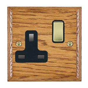 Hamilton WOMSS1PB-B Woods Ovolo Medium Oak 1 gang 13A Double Pole Switched Socket Polished Brass/Black Insert