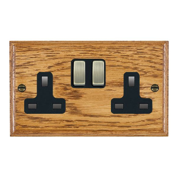 Hamilton WOMSS2AB-B Woods Ovolo Medium Oak 2 gang 13A Double Pole Switched Socket Antique Brass/Black Insert